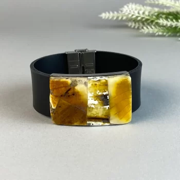 Stylish black leather bracelet with speckled amber detail