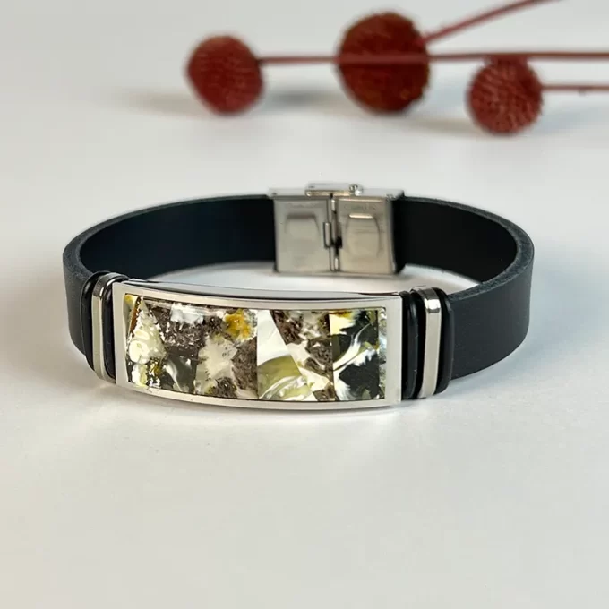 Stylish black men's leather bracelet with blue landscape amber detail