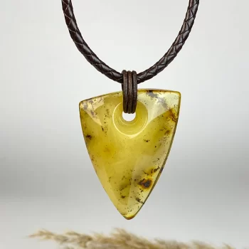Stylish amber mossy necklace on leather cord