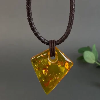 Stylish clear honey coloured amber men's neck pendant on leather cord