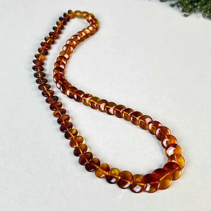Stylish transparent honey coloured floppy amber necklace