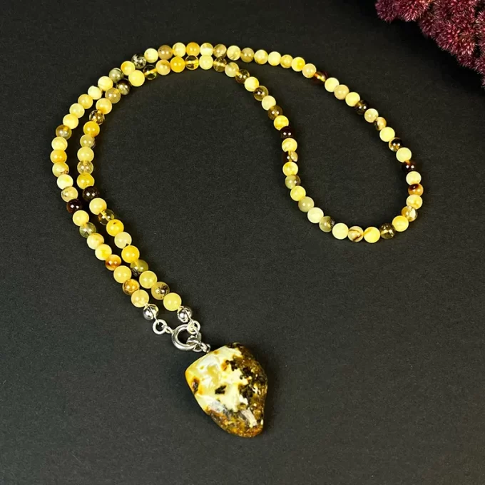 Charming landscape amber necklace with speckled amber pendant