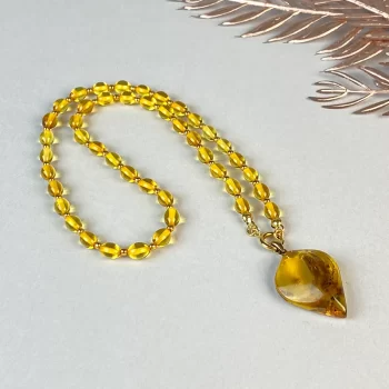 Fine clear amber necklace with clear pendant with inlay 2