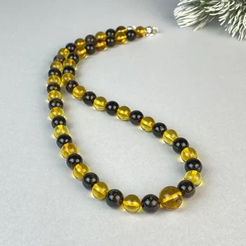 Fine necklace with dark and clear amber beads 2