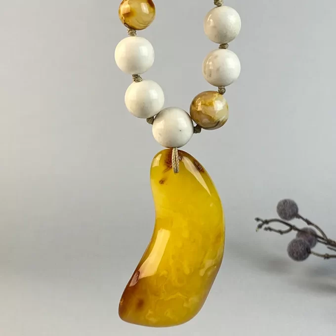 Spectacular elk antler and speckled amber bead necklace with yellow amber pendant