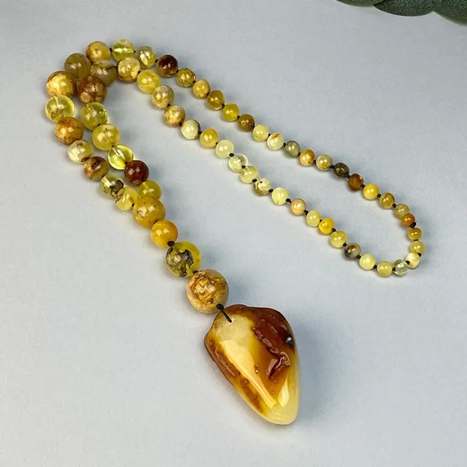 Massive amber beaded necklace with pendant pendant