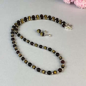 Gorgeous frosted cherry and faceted greenish amber necklace and set of earwires