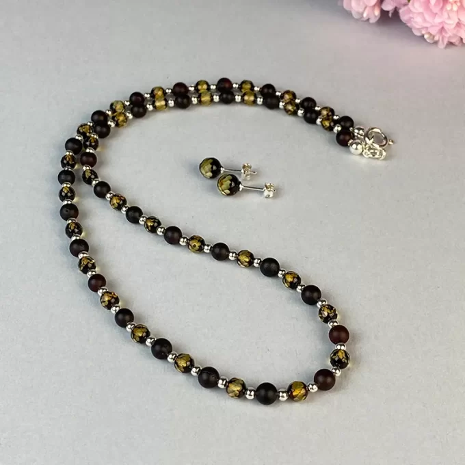 Gorgeous frosted cherry and faceted greenish amber necklace and set of earwires