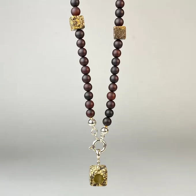 Sophisticated matt cherry and moss amber necklace with pendant