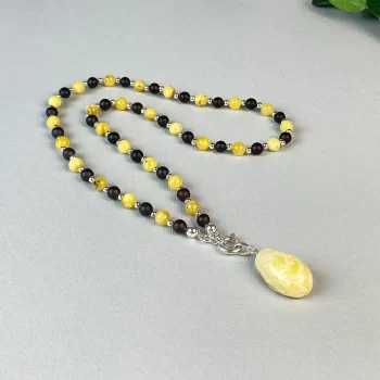 Playful matte black and shiny yellow amber necklace with landscape amber pendant 2