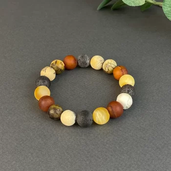 Beautiful bracelet of frosted speckled amber balls resembling celestial bodies
