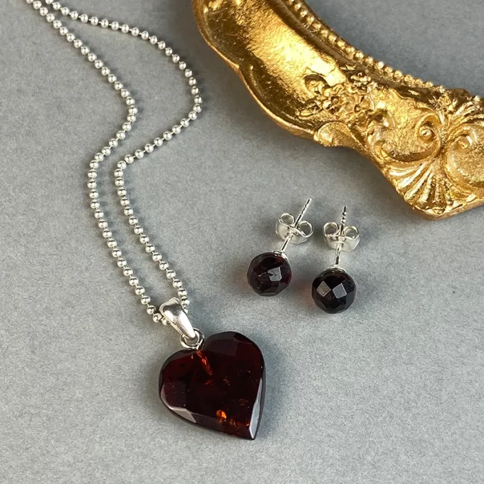 Fine faceted cherry amber pendant and earring tacks set