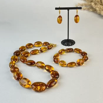 Fine set of honey coloured amber earrings, necklace and bracelet