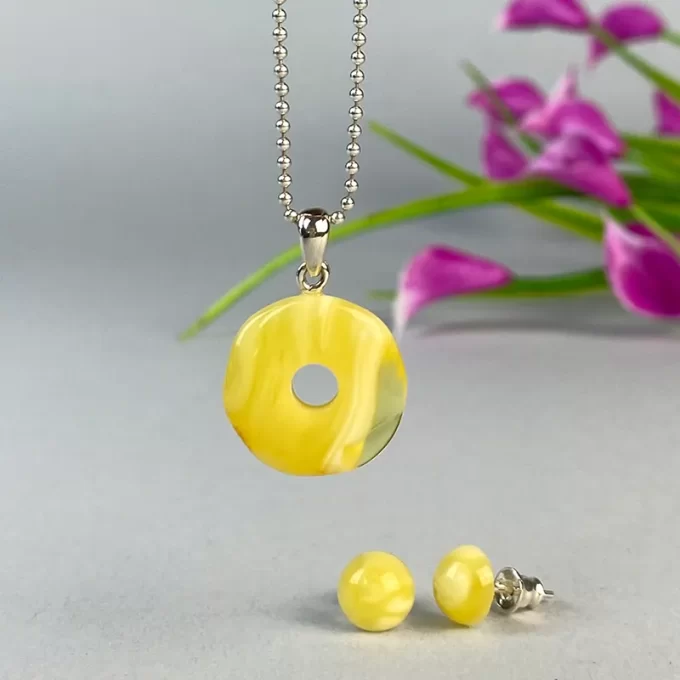 Stylish set of yellow landscape amber stud earrings and amulet pendant