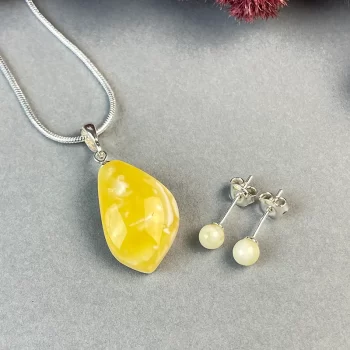 Stylish set of landscape amber earring pins and abstract shaped neck pendant