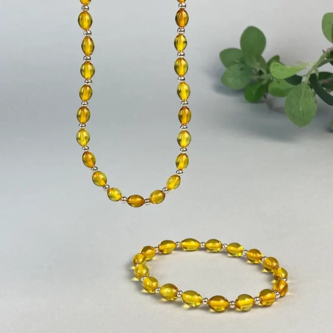 Stylish clear amber bean necklace and bracelet set