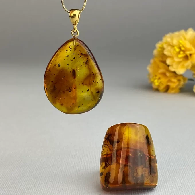 Delicate clear honey coloured amber with inlays pendant and ring set